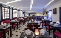 Restaurace v ubytování قرية ميراج باي