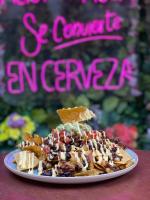 a plate of food with a dessert on a table at El Jardín Escondido by Soma in Baños