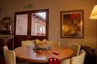 a dining room table with a basket on top of it at San Ignacio Estancia Andina in El Challao