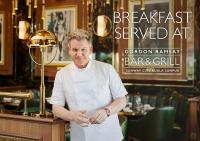 a man in a chefs uniform standing in a restaurant at Sunway Resort Hotel in Kuala Lumpur