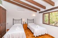 A bed or beds in a room at Villa La Casita by Sealand Villas