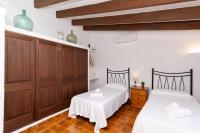A bed or beds in a room at Villa La Casita by Sealand Villas