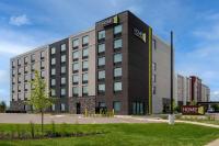 a large building with a sign on the side of it at Home2 Suites By Hilton Thunder Bay in Thunder Bay