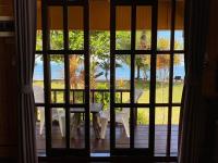 a view of a table and chairs through a window at Koh Chang Bailan Beach Resort in Ko Chang