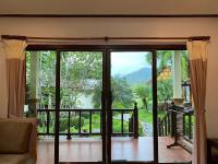 a room with a sliding glass door with a view at Koh Chang Bailan Beach Resort in Ko Chang