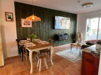 A television and/or entertainment centre at Los Nietos Apartment