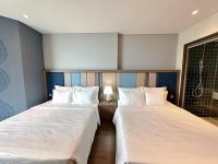 Apec Mandala Wyndham Mũi Né - R1210にあるベッド
