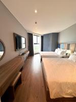 Apec Mandala Wyndham Mũi Né - R1210にあるベッド