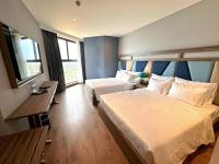 Apec Mandala Wyndham Mũi Né - R1210にあるベッド
