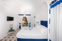 Posteľ alebo postele v izbe v ubytovaní Hotel Punta Regina
