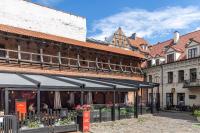 a building with a balcony on top of it at Konventa Sēta Hotel Keystone Collection in Riga