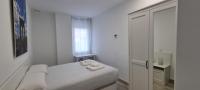 Postel nebo postele na pokoji v ubytování APARTAMENTOS TANEZ SANTURCE a