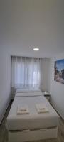 Postel nebo postele na pokoji v ubytování APARTAMENTOS TANEZ SANTURCE a