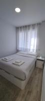 Postel nebo postele na pokoji v ubytování APARTAMENTOS TANEZ SANTURCE a