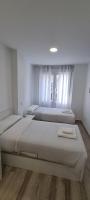 Postel nebo postele na pokoji v ubytování APARTAMENTOS TANEZ SANTURCE a