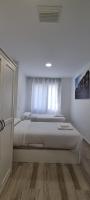 Postel nebo postele na pokoji v ubytování APARTAMENTOS TANEZ SANTURCE a