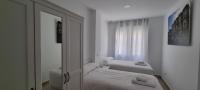 Postel nebo postele na pokoji v ubytování APARTAMENTOS TANEZ SANTURCE a