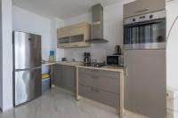 Kuchyňa alebo kuchynka v ubytovaní PANORAMICA - Apartman