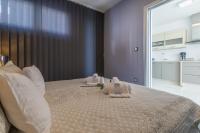 Posteľ alebo postele v izbe v ubytovaní PANORAMICA - Apartman