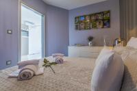 Posteľ alebo postele v izbe v ubytovaní PANORAMICA - Apartman