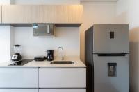 Condo Hotel Porto Horizonteにあるキッチンまたは簡易キッチン