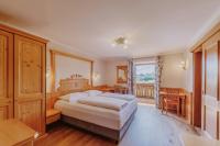 Łóżko lub łóżka w pokoju w obiekcie Landhotel Gschirnwirt