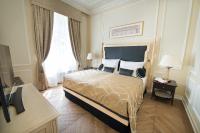 a hotel room with a bed and a large window at Wilson Palace by LOFT in Bratislava