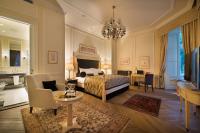 a bedroom with a bed and a living room at Wilson Palace by LOFT in Bratislava