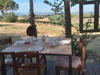 een houten tafel met borden met eten erop bij Agriturismo La Terra in Valiano