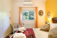 Postel nebo postele na pokoji v ubytování Villa Val de Rosa