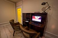 a room with a desk with a computer and two chairs at Wilson Palace by LOFT in Bratislava