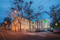 a building on the side of a street at night at Wilson Palace by LOFT in Bratislava