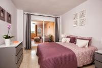Posteľ alebo postele v izbe v ubytovaní Elviria Apartment