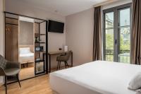Postel nebo postele na pokoji v ubytování Sunotel Central