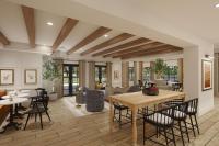 a dining room and living room with a table and chairs at Tiller House, Laguna Hills, a Tribute Portfolio Hotel in Laguna Hills