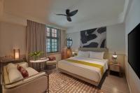 21 Carpenter, Singapore, a Member of Design Hotelsにあるベッド