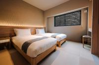 Ski Inn Hakuba, Iwatakeにあるベッド
