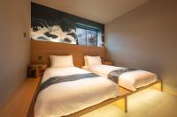 Ski Inn Hakuba, Iwatakeにあるベッド
