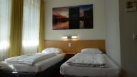 Postel nebo postele na pokoji v ubytování CVJM Düsseldorf Hotel & Tagung
