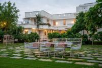 a table and chairs in front of a building at Naila Kothi - A Luxury Boutique Royal Suites in Jaipur in Jaipur