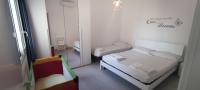 Posteľ alebo postele v izbe v ubytovaní Donna Beatrice aMare beach house
