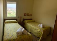 A bed or beds in a room at Casa Jazmín Fuentes de Almuñecar