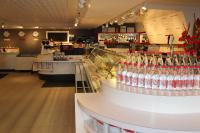 a bar with bottles of wine on a counter at Les Suites Hotel Ottawa in Ottawa