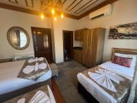Postel nebo postele na pokoji v ubytování April Hotel