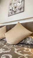 a pile of pillows on a bed in a room at Hotel Genova Liberty in Genoa