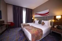 Postel nebo postele na pokoji v ubytování Ramada by Wyndham Istanbul Alibeykoy