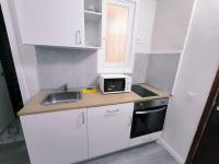 Kuchyň nebo kuchyňský kout v ubytování Apartamentos Carrillo 7
