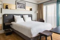 Ein Bett oder Betten in einem Zimmer der Unterkunft Mercure Paris Saint-Ouen