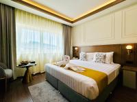 Postel nebo postele na pokoji v ubytování Fortune Plaza Hotel, Dubai Airport