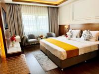 Postel nebo postele na pokoji v ubytování Fortune Plaza Hotel, Dubai Airport
